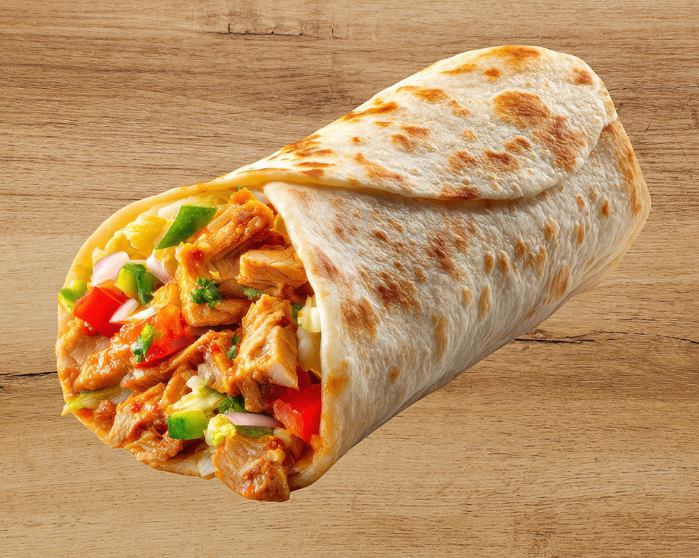 A freshly made chicken burrito filled with grilled meat